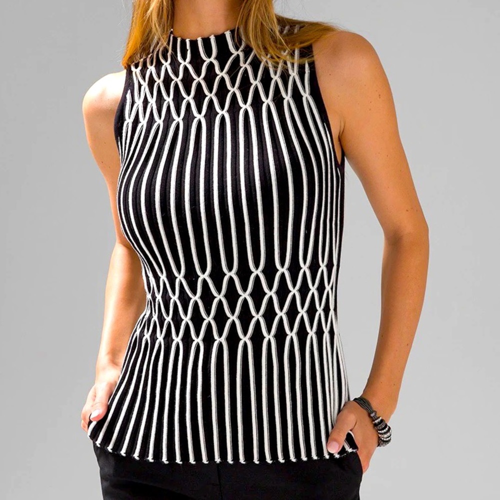 WHBM (White House Black Market) sleeveless mock neck peplum sweater.